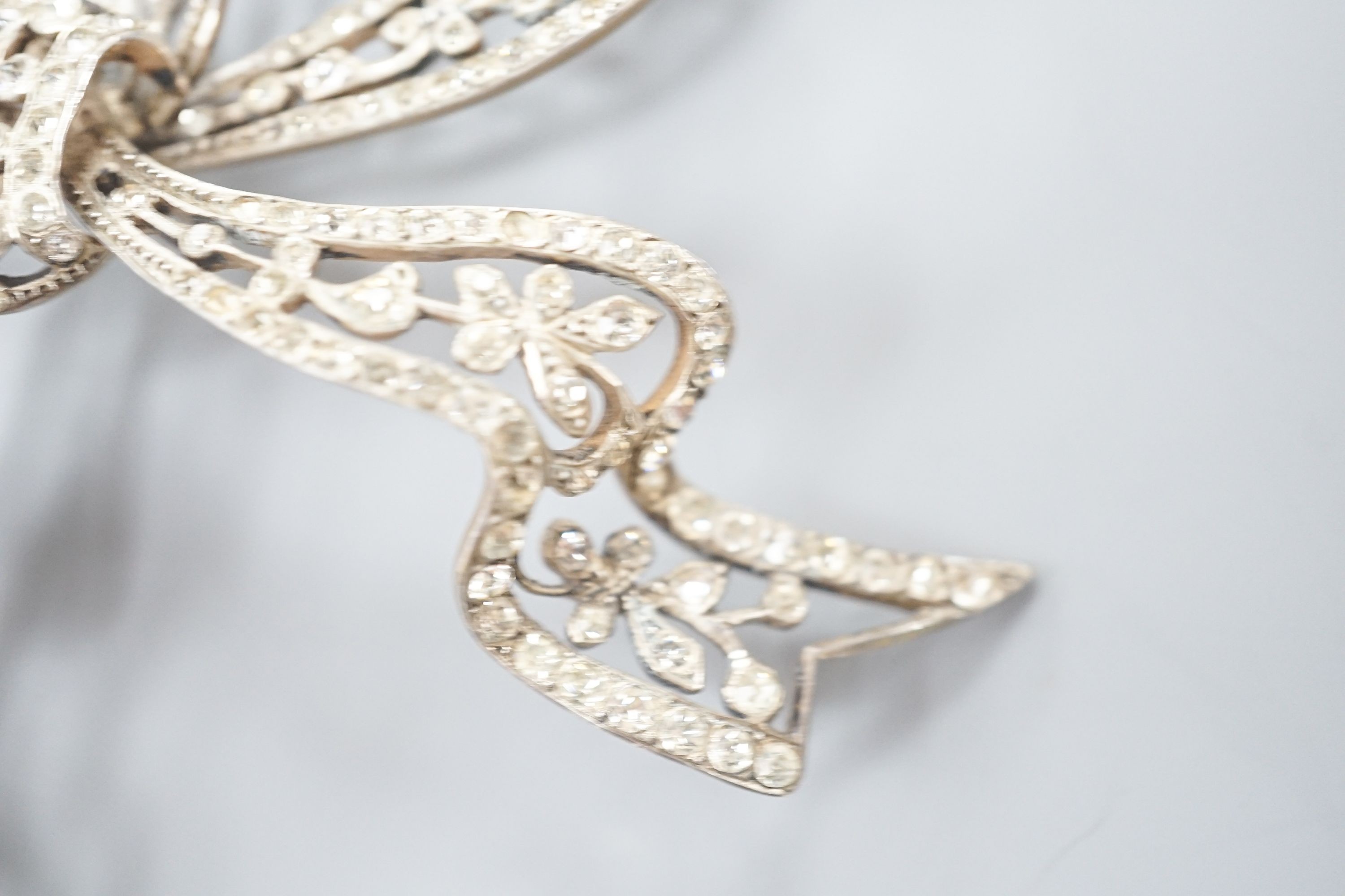 A sterling and paste set large ribbon bow brooch, width 95mm.